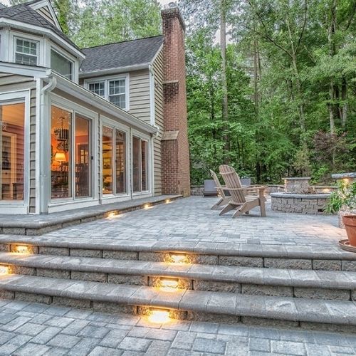 patio pavers and backyard fire pit in massachusetts residential backyard