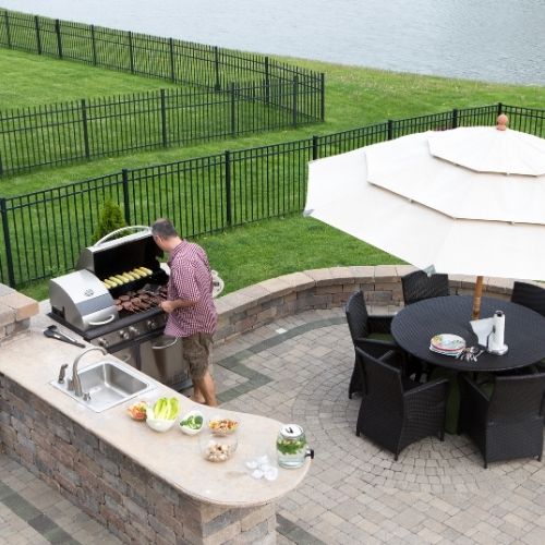 Bring an extra layer of entertainment to your home with an outdoor grill kitchen