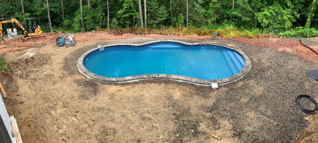 The JM Mento landscape design team build a swimming pool in Massachusetts