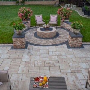 fire pit and outdoor kitchen in backyard of residential home in Massachusetts